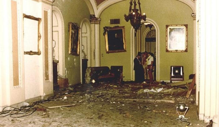 ornate room with debris and damage