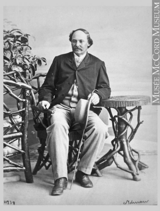 Black and white photo of Duncanson seated in chair