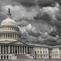 The United States Capitol in Washington DC with dark storm clouds