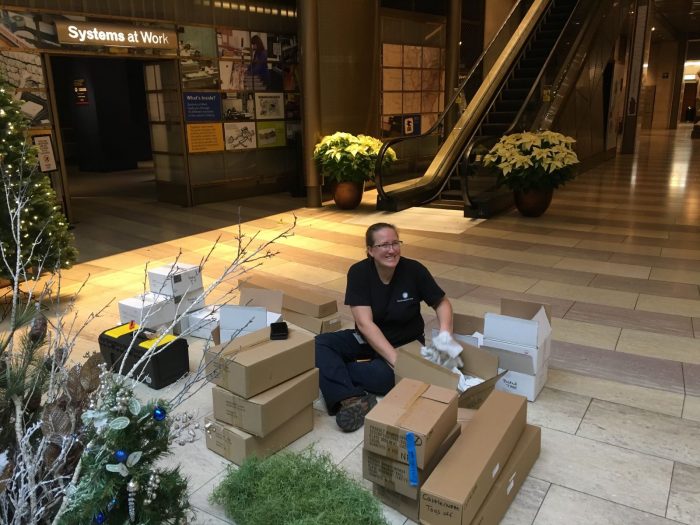 Thompson unpacking foliage decorations