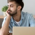 Bored Guy in front of laptop