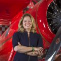 Ellen Stofan in front of red airplane