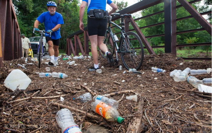 Plastic bottles and other trash on bike path