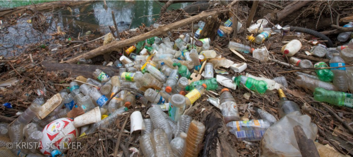 Plastic trash washed up on riverbank
