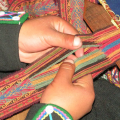 close up of hands at loom