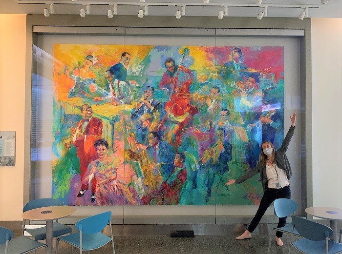 Lizzie Peabody posing in front of Big Band painting
