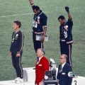 Black athletes raising black power fist at 1968 Olympics