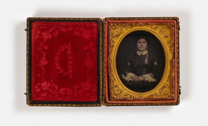 Portrait of woman in red velvet case