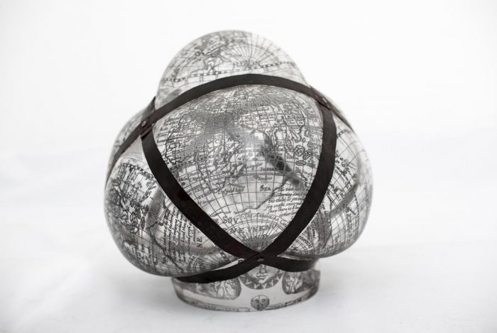 Distorted glass sculpture of globe