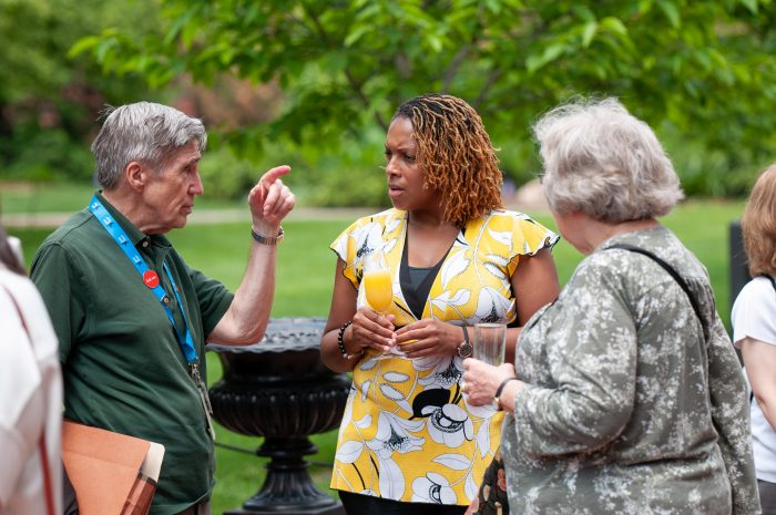 OVS director Sherri Wheeler talks with volunteers at the 2018 Volunteer Appreciation Event