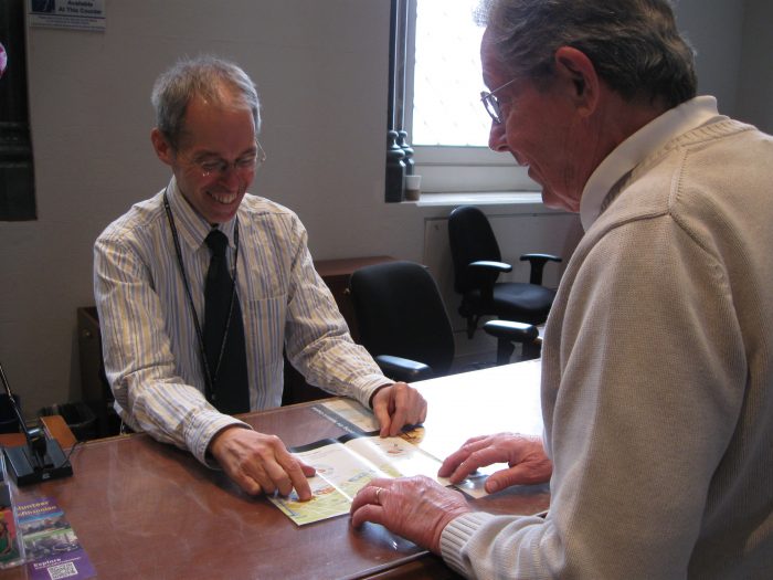 Office of Visitor Services (OVS) staff Bill Blandy assists visitor. Taken 3/25/2014