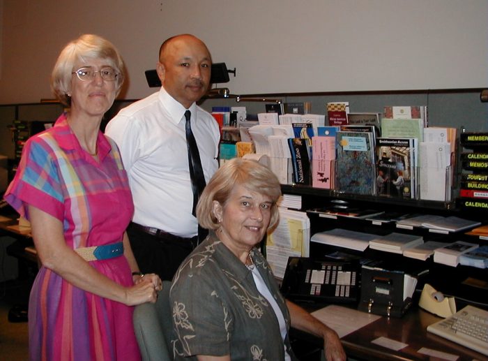 Barbara McBride, Andre Henderson, and Cordelia Benedict (seated), TIS staff. (Photo by Dana Small, 2000)