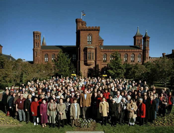 Volunteers gather for a group photo with Secretary Lawrence Small (2006)