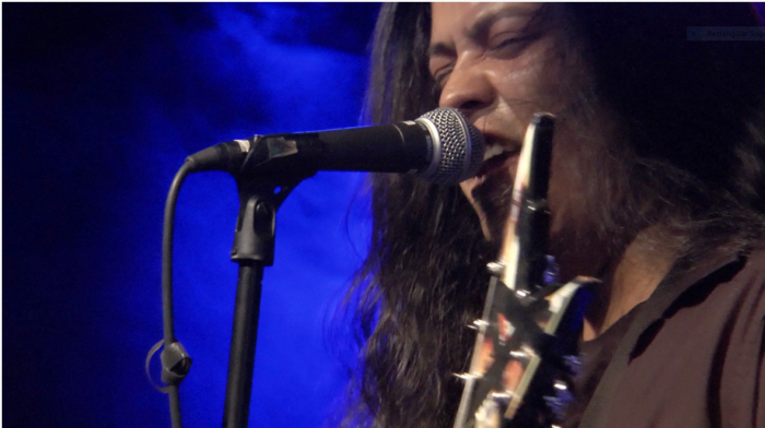 Close up of man singing into microphone