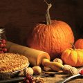 Stock photo of pie with pumkin and Thanksgiving table