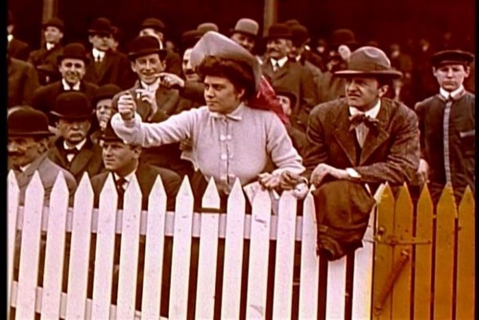 Sepia photo of fans at early baseball game