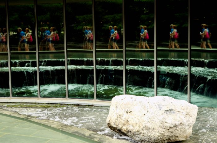 photo of people reflected in window