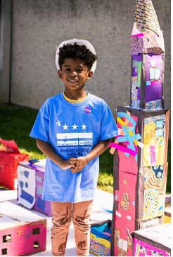 Young student poses with his creation