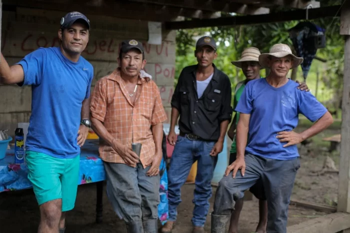 Researchers pose with local farmers