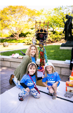 Maria McLean with young students in HMSG garden