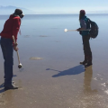 Cropped banner image of researchers on a beach