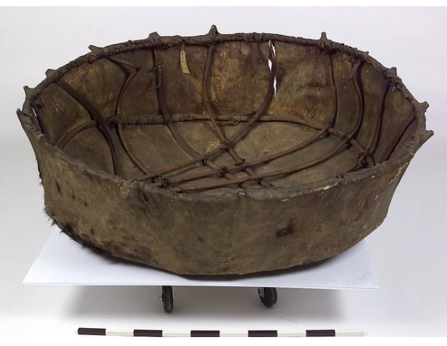 Round coracle-style boat made of buffalo hide