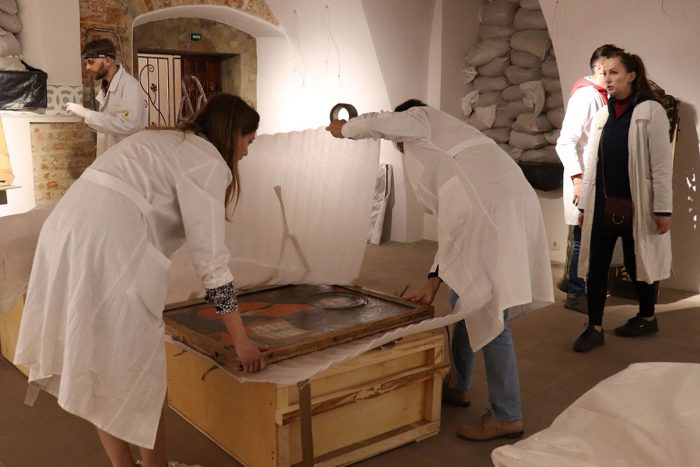 Conservators wrap painting for storage