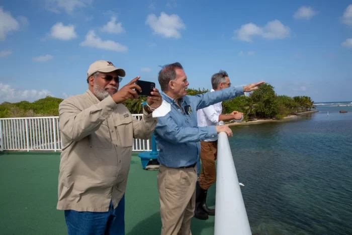 Secretary BUnch takes a picture while standing on balcony MOreno and Tewksbury