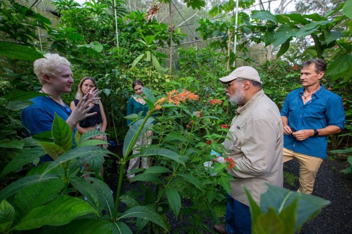 Secretary Bunch speaks with staff in greenhouse