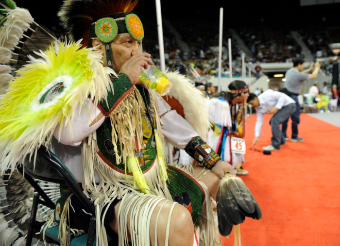 Native man in ceremonial dress