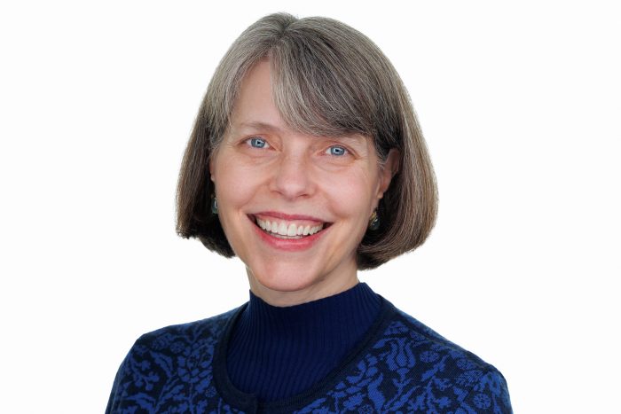 Head shot of Farleigh Everhart in blue suit against white background