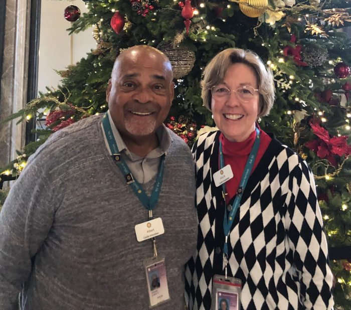 Albert Howard and Julia Smith in front of Castle Christmas tree