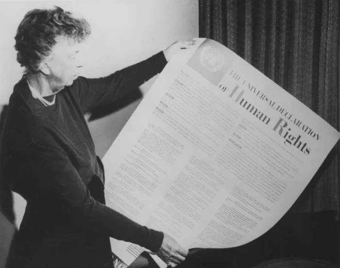 Eleanor Roosevelt holds a copy of the Universal Declaration of Human Rights