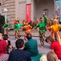 Colorful dancers performing in front of Freer Gallery