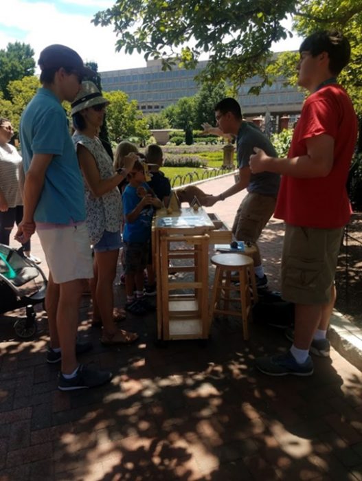 Teen docents and Bison in our Backyard cart