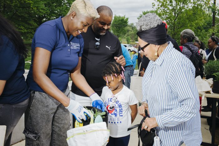 Visitors check their goodie bags at ACM Earth Day event