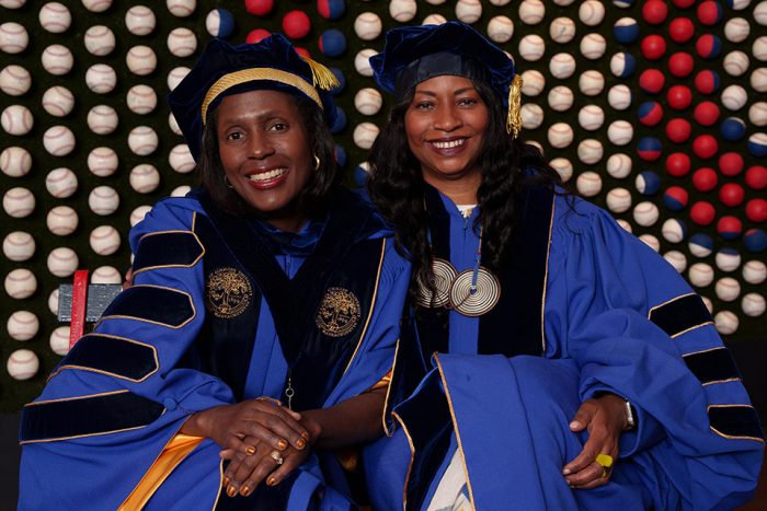 Wooten and Evangelistia in academic robes
