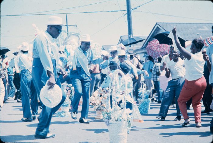 African American visitors dancing along with performers