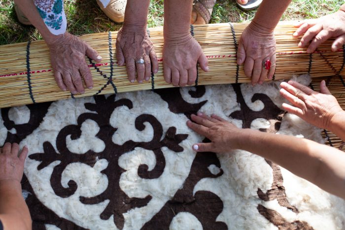 Women working on a traditional Kazakh felt design