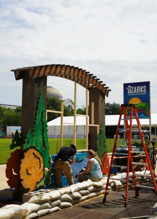 Worker on the National Mall installing Folklife exhibit