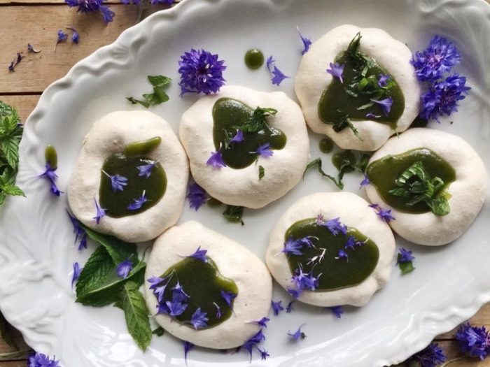 Dumplings with green sauce and blue flower petals