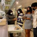 Masked young people in the Q?rius science center
