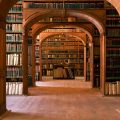 Stock photo of library seen through series of arched doorways