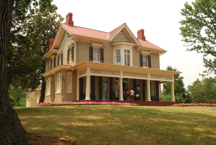 Farmhouse style home with broad front porch and pillars