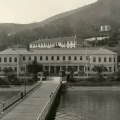 Black and white photo of old immigration station on Angel Island near San Francisco with long pier