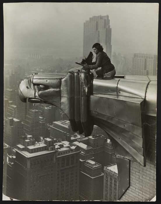 Black and white photo of Margaret Bourke-White atop the Chrysler Building