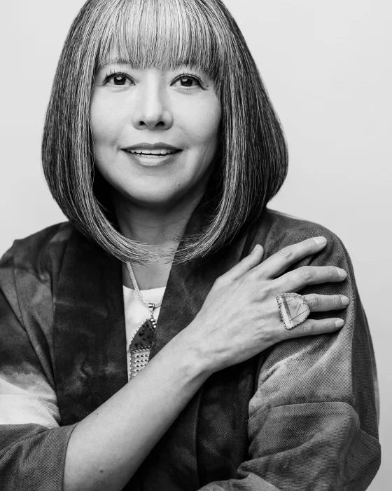 B&W head shot of Chavez-Lamar wearing large ring 