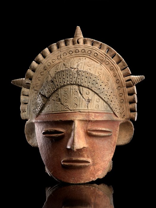 Clay head wearing intricate headdress