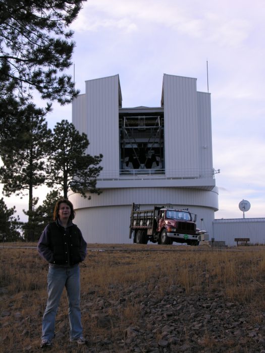 Collins stands outside observatory