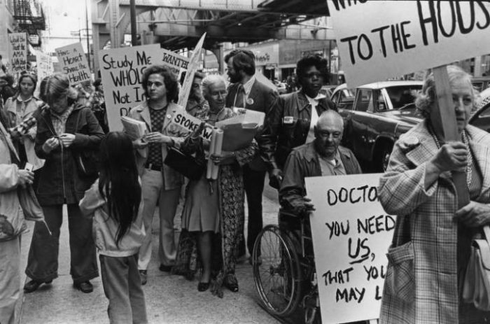 Black and white photo of protest march against ageism